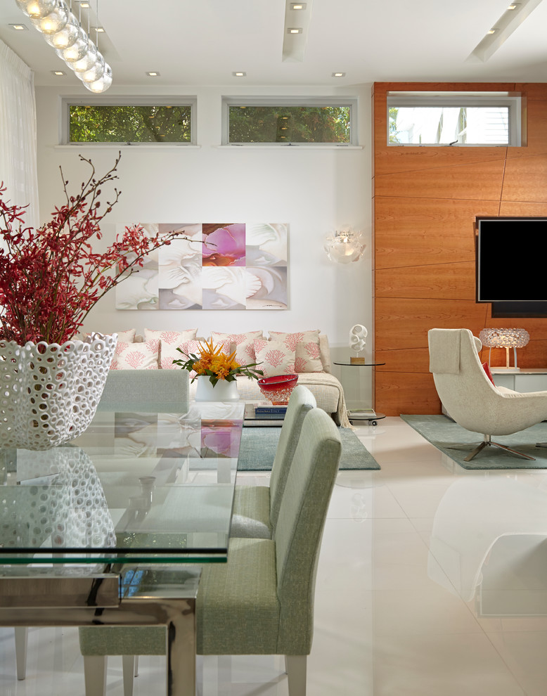 This is an example of a mid-sized contemporary open plan dining in Miami with white walls and marble floors.