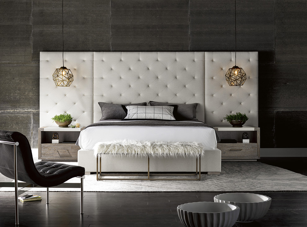 Photo of a modern bedroom in Houston with grey walls, dark hardwood floors and black floor.