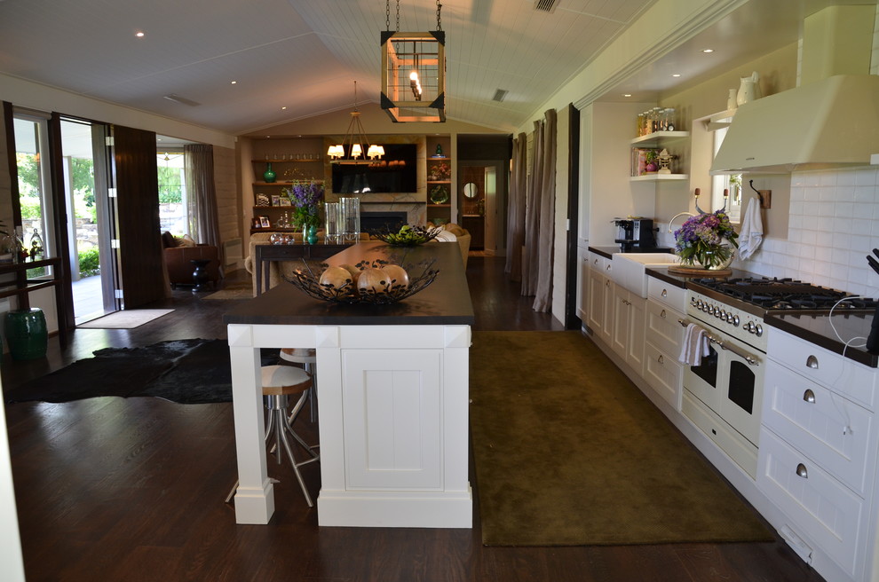 Mid-sized country open plan kitchen in Melbourne with dark hardwood floors and brown floor.
