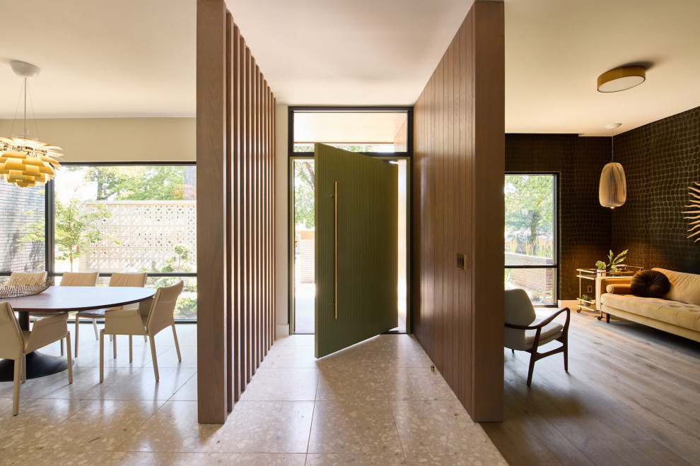 Inspiration for a 1960s terrazzo floor pivot front door remodel with a green front door