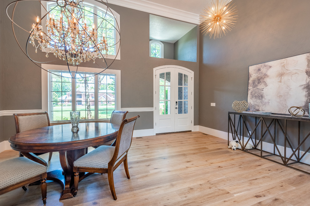 Design ideas for a country open plan dining in Other with grey walls and light hardwood floors.