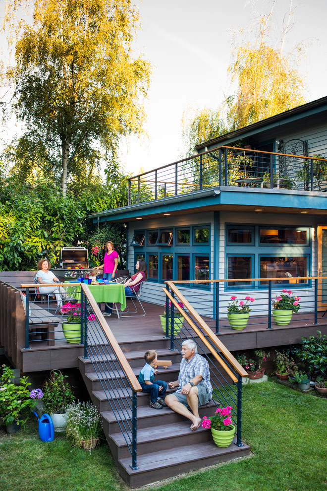 Photo of a midcentury backyard deck in Seattle.