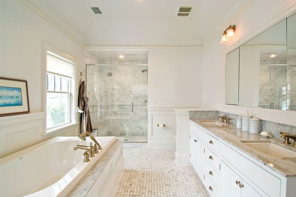 Drop-in bathtub - mid-sized transitional master gray tile, multicolored tile, white tile and stone slab marble floor and multicolored floor drop-in bathtub idea with recessed-panel cabinets, white cabinets, white walls, an undermount sink, marble countertops and a hinged shower door