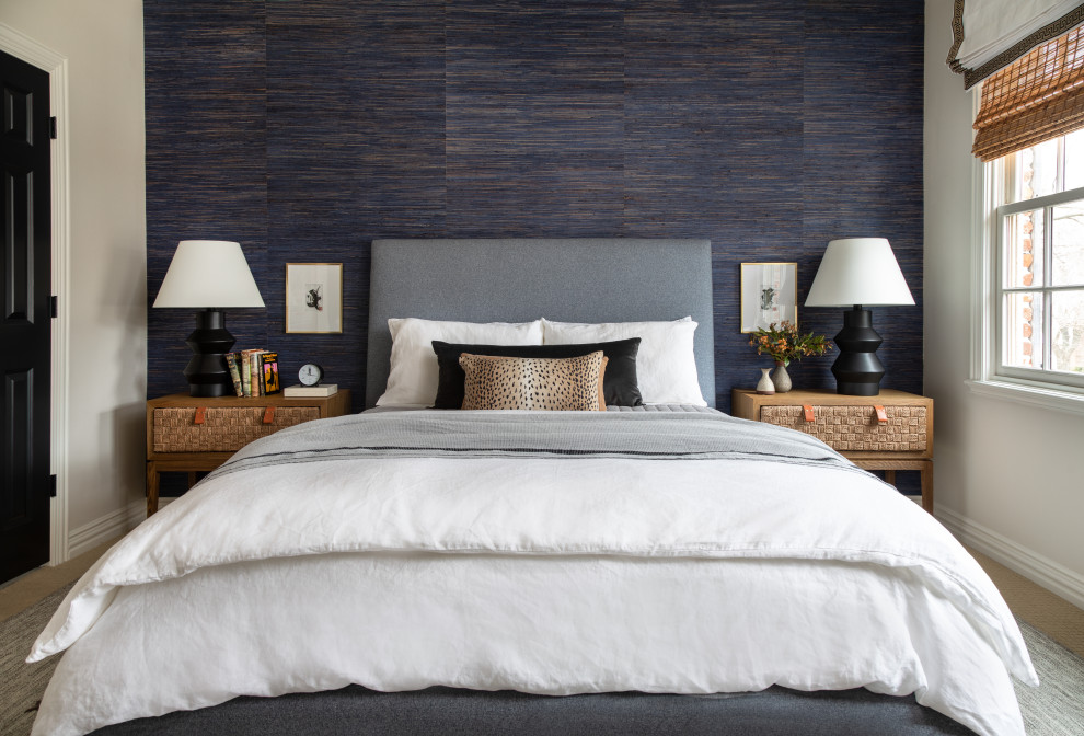 This is an example of a transitional bedroom in Houston with blue walls, carpet, beige floor and wallpaper.