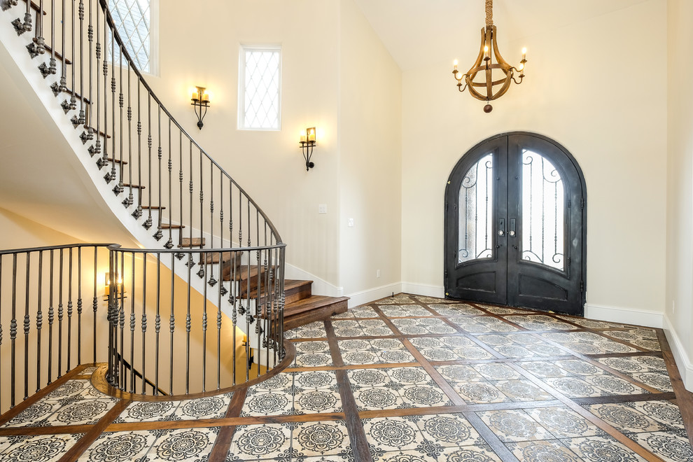 Photo of a large transitional foyer in Denver with beige walls, painted wood floors, a double front door and a metal front door.