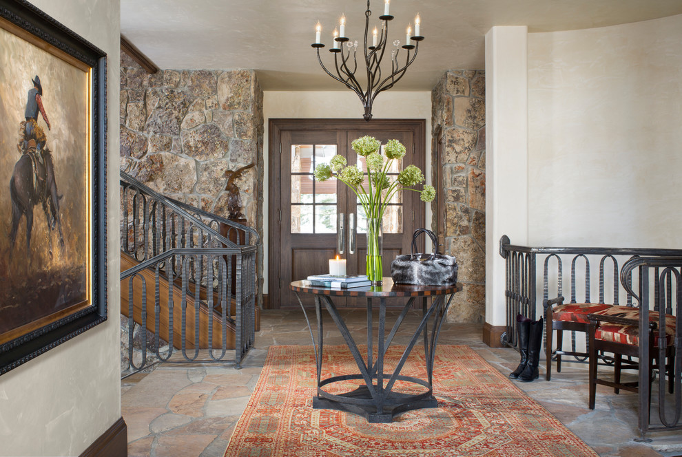 Inspiration for a small country foyer in Denver with multi-coloured walls, a double front door and a dark wood front door.