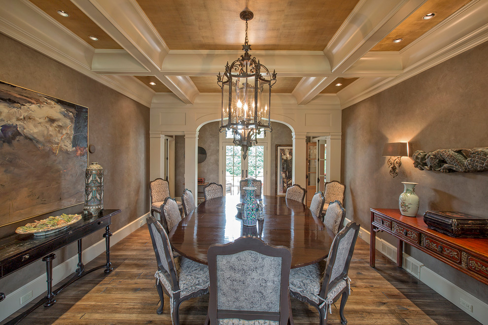 Inspiration for a large traditional separate dining room in Omaha with brown walls, medium hardwood floors, no fireplace and brown floor.