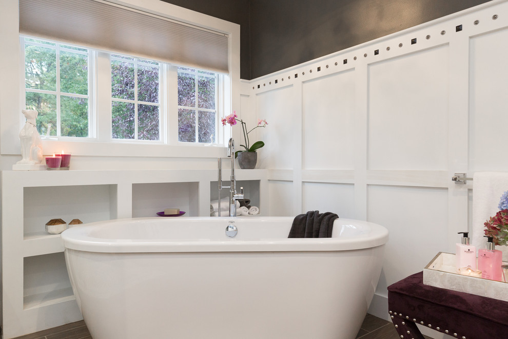 Design ideas for a large transitional master bathroom in Manchester with recessed-panel cabinets, white cabinets, a freestanding tub, an open shower, a one-piece toilet, white tile, stone tile, black walls, dark hardwood floors, an undermount sink and engineered quartz benchtops.