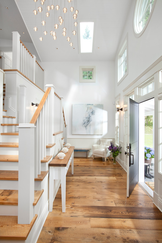 Design ideas for a traditional entryway in Vancouver with a black front door.