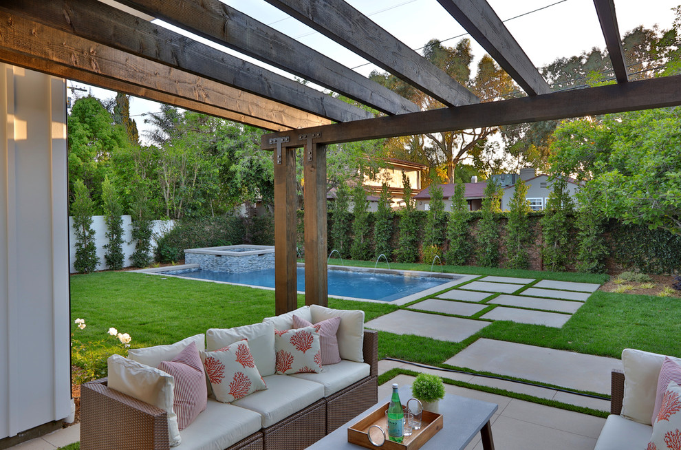 Photo of a small country backyard patio in Los Angeles with concrete slab and a pergola.