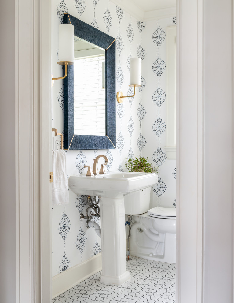 Powder room - small transitional mosaic tile floor, white floor and wallpaper powder room idea in Nashville with white cabinets, a two-piece toilet, white walls and a pedestal sink