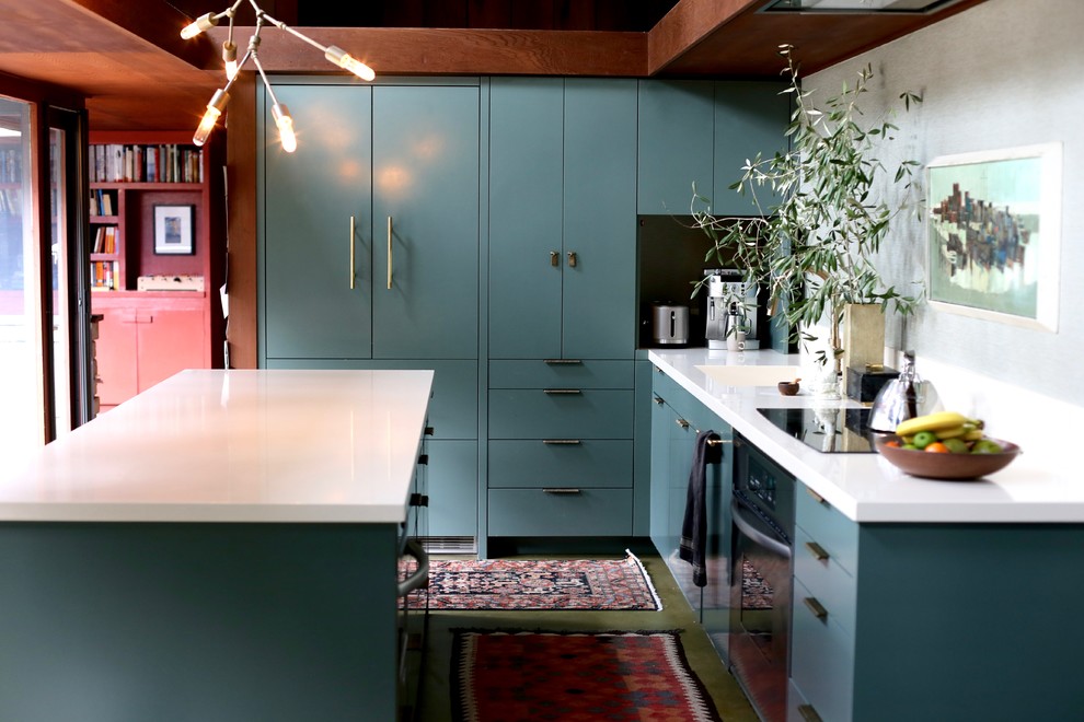 Inspiration for a mid-sized transitional galley eat-in kitchen in San Francisco with an integrated sink, flat-panel cabinets, green cabinets, granite benchtops, green splashback, concrete floors, with island and green floor.