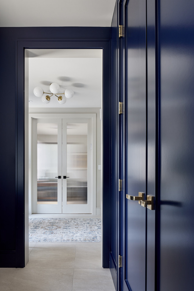 Example of a mid-sized transitional porcelain tile and gray floor vestibule design with blue walls