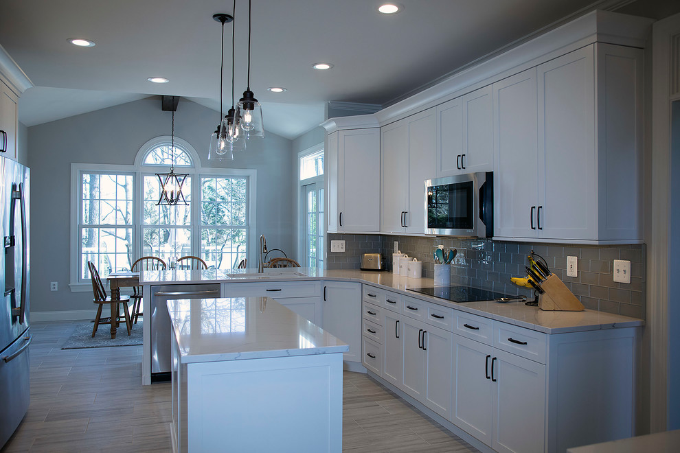 Inspiration for a large transitional u-shaped kitchen remodel in DC Metro with shaker cabinets, white cabinets and an island