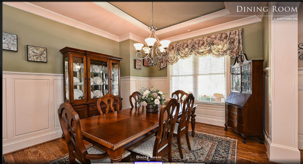 This is an example of a large arts and crafts open plan dining in Charlotte with beige walls and medium hardwood floors.