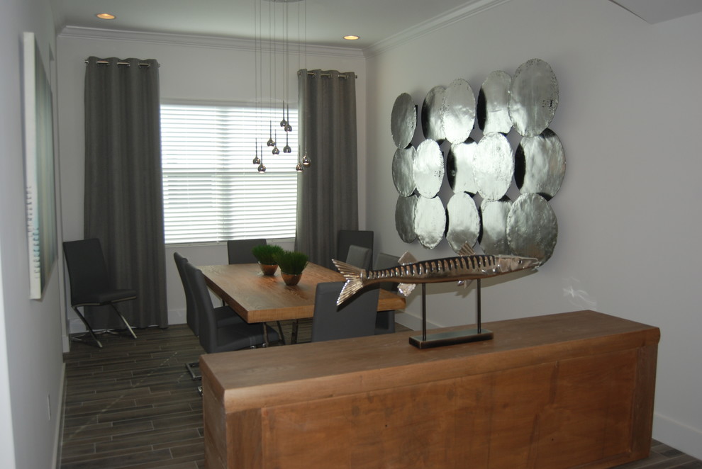 Mid-sized contemporary dining room in Miami with porcelain floors.