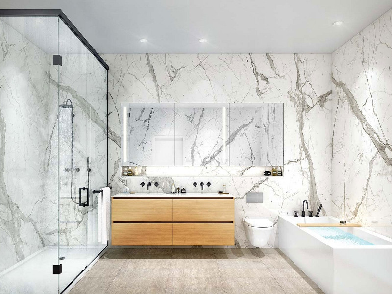 This is an example of a large modern master bathroom in Vancouver with flat-panel cabinets, brown cabinets, a claw-foot tub, a curbless shower, a wall-mount toilet, white tile, porcelain tile, porcelain floors, a drop-in sink, quartzite benchtops, beige floor, a hinged shower door, white benchtops, a double vanity, a floating vanity and vaulted.