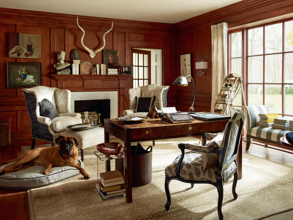 Traditional study room in Other with medium hardwood floors, a standard fireplace and a freestanding desk.