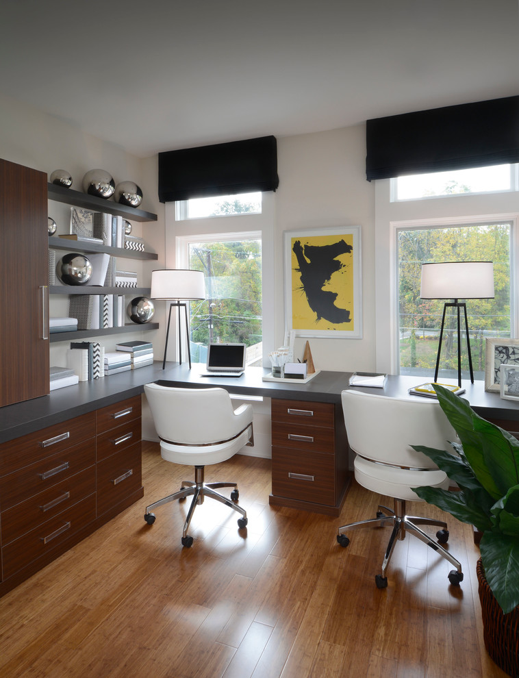 Photo of a small contemporary study room in DC Metro with bamboo floors and a built-in desk.