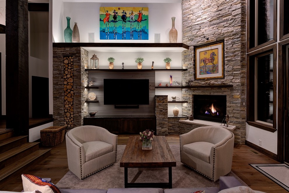 Inspiration for a large contemporary open concept living room in Salt Lake City with white walls, medium hardwood floors, a corner fireplace, a stone fireplace surround, a built-in media wall and brown floor.