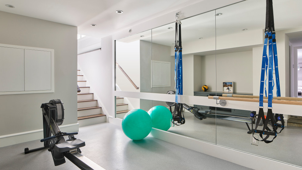 This is an example of a small contemporary multipurpose gym in Philadelphia with grey walls and grey floor.