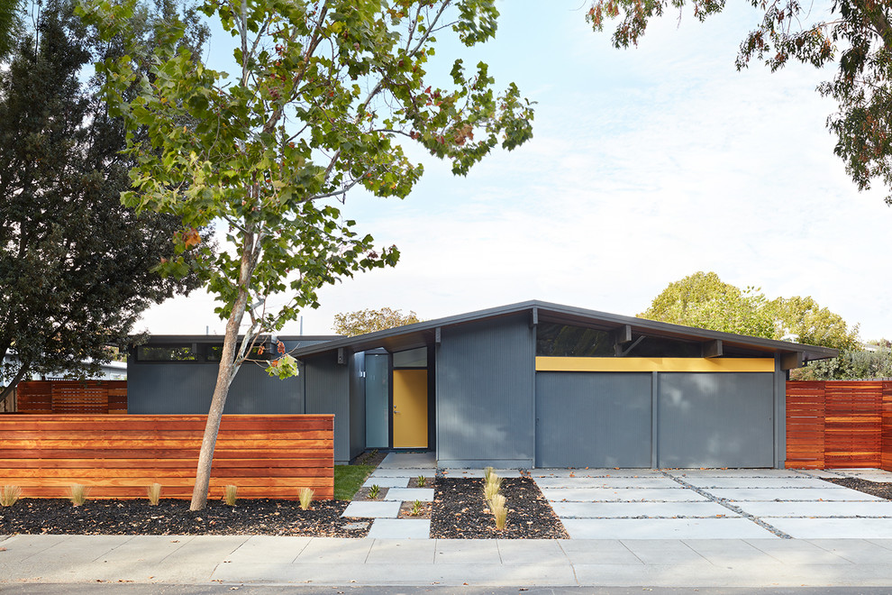 Example of a mid-century modern gray one-story exterior home design in San Francisco