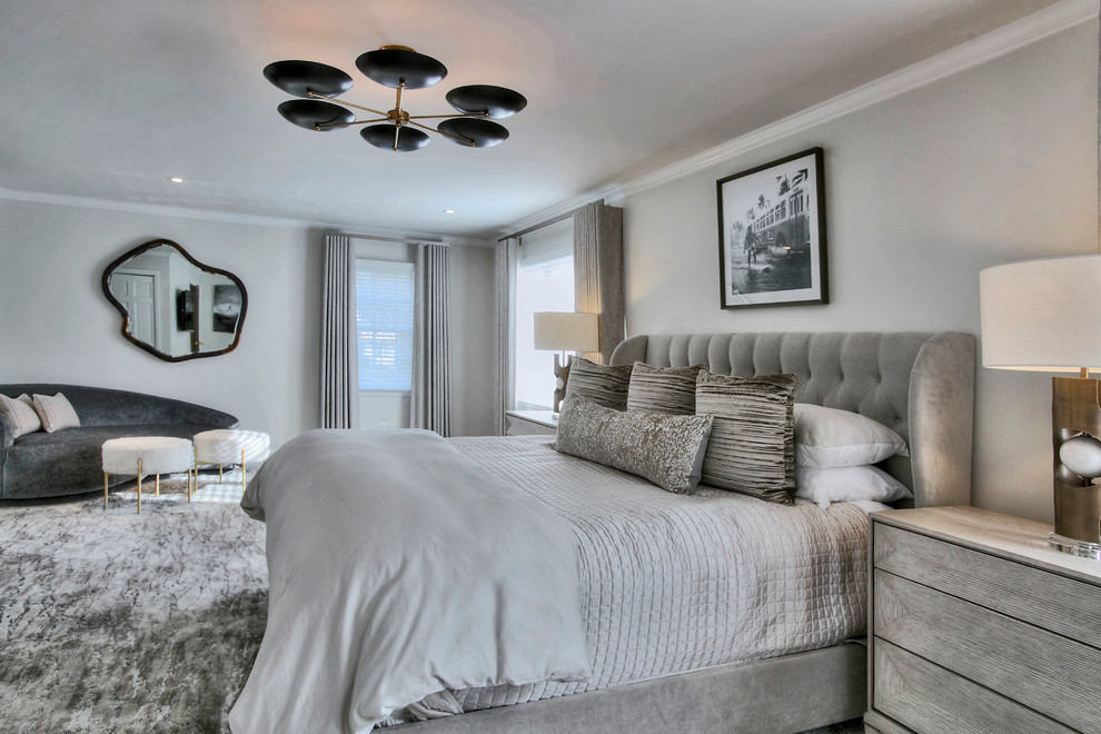 Large transitional guest bedroom in New York with grey walls, carpet, grey floor and no fireplace.