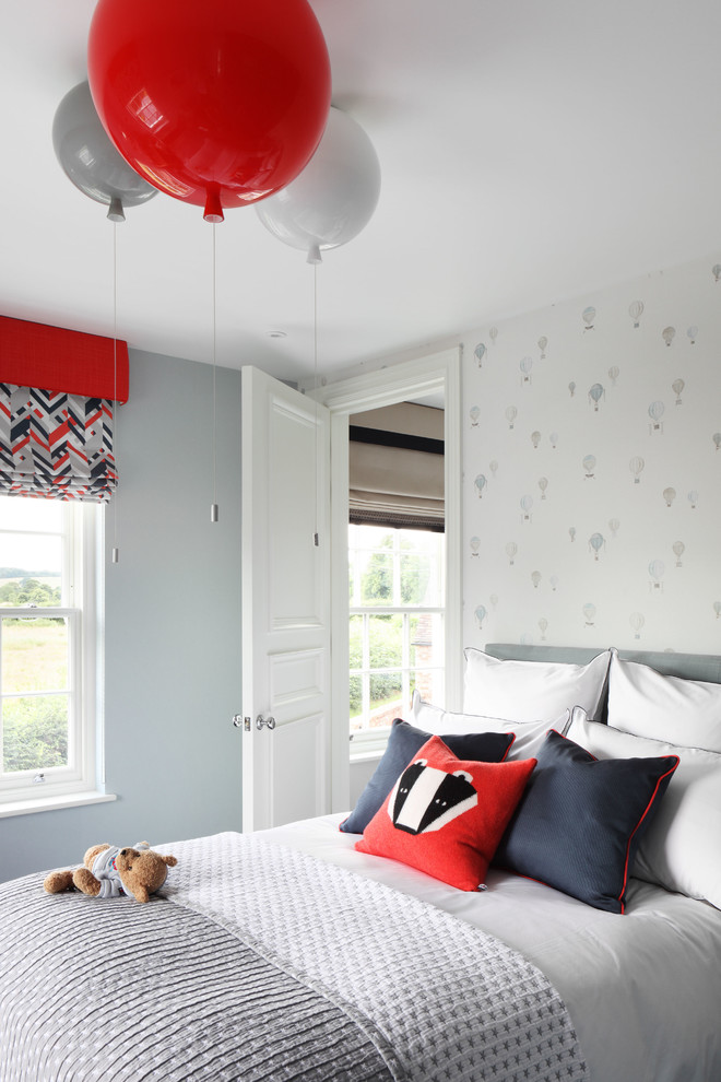 This is an example of a mid-sized contemporary kids' bedroom for kids 4-10 years old and boys in London with grey walls.