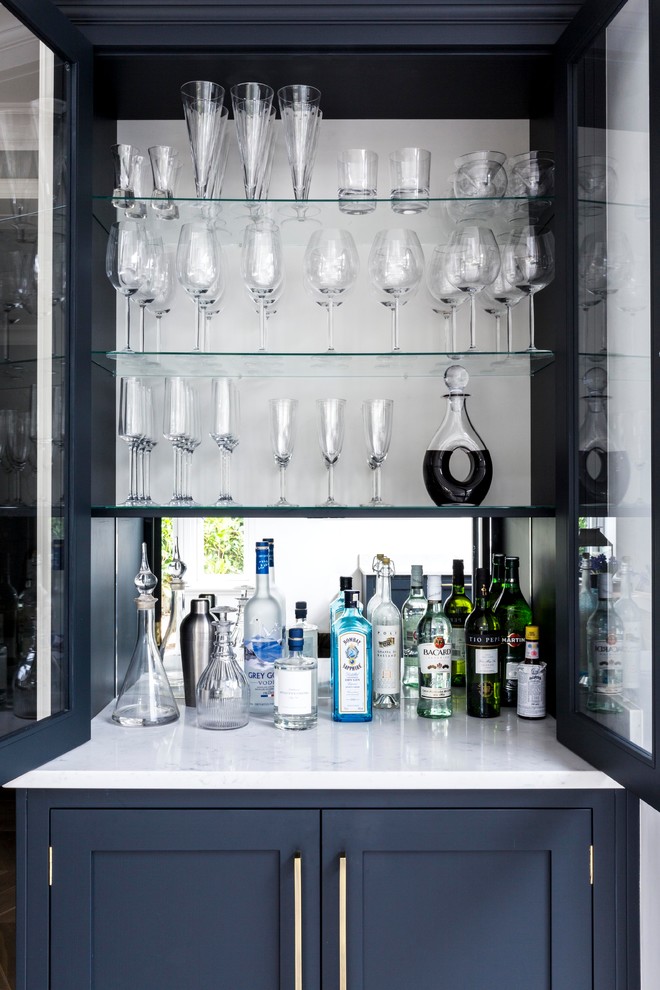 Photo of a transitional home bar in Surrey.