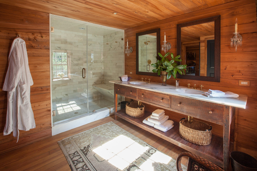 Design ideas for a country master bathroom in Charleston with an undermount sink, dark wood cabinets, marble benchtops, an alcove shower, brown walls, medium hardwood floors and open cabinets.