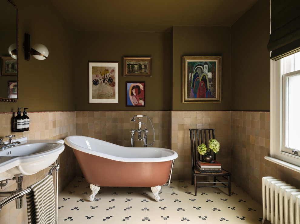 Design ideas for a bohemian bathroom in London with a claw-foot bath, beige tiles, green walls, a console sink, beige floors, white worktops and double sinks.