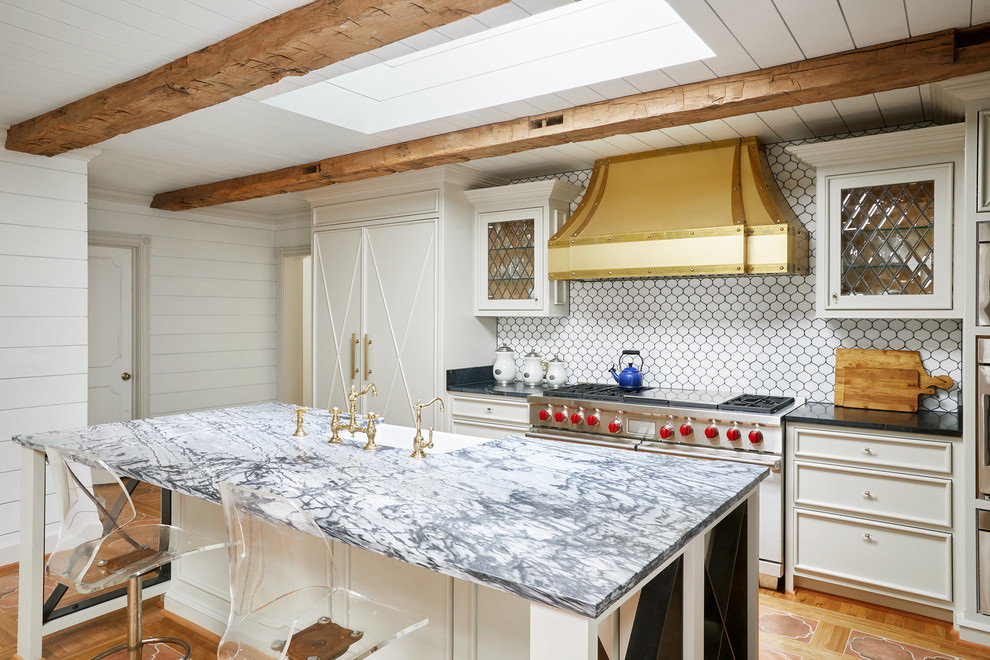 Mid-sized eclectic l-shaped terra-cotta tile and orange floor open concept kitchen photo in Nashville with recessed-panel cabinets, blue cabinets, white backsplash, paneled appliances, an island, an undermount sink, quartzite countertops and ceramic backsplash
