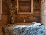 Rustic Powder Room by North Fork Builders of Montana, Inc.