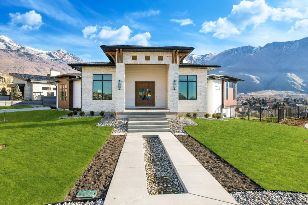 Photo of a large and white modern bungalow detached house in Salt Lake City with mixed cladding, a hip roof, a mixed material roof, a black roof and shiplap cladding.