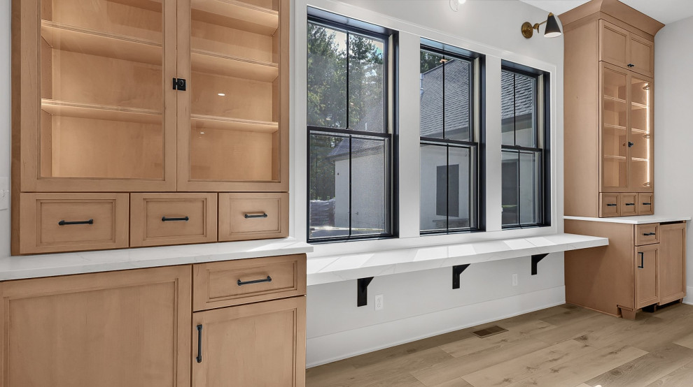 Inspiration for a transitional u-shaped vinyl floor and exposed beam eat-in kitchen remodel in Columbus with shaker cabinets, light wood cabinets, quartz countertops, white backsplash, subway tile backsplash, stainless steel appliances, an island, white countertops and a farmhouse sink