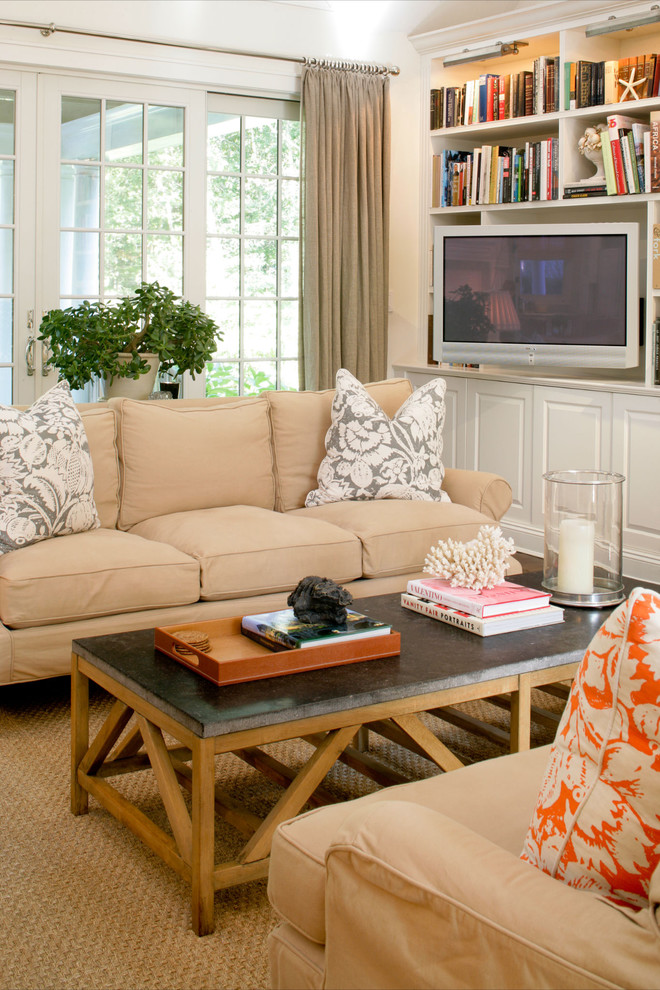 Design ideas for a transitional family room in New York with a built-in media wall.