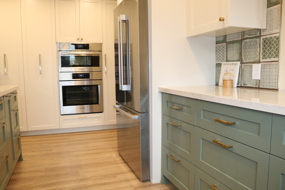 Example of a mid-sized transitional kitchen design with green cabinets