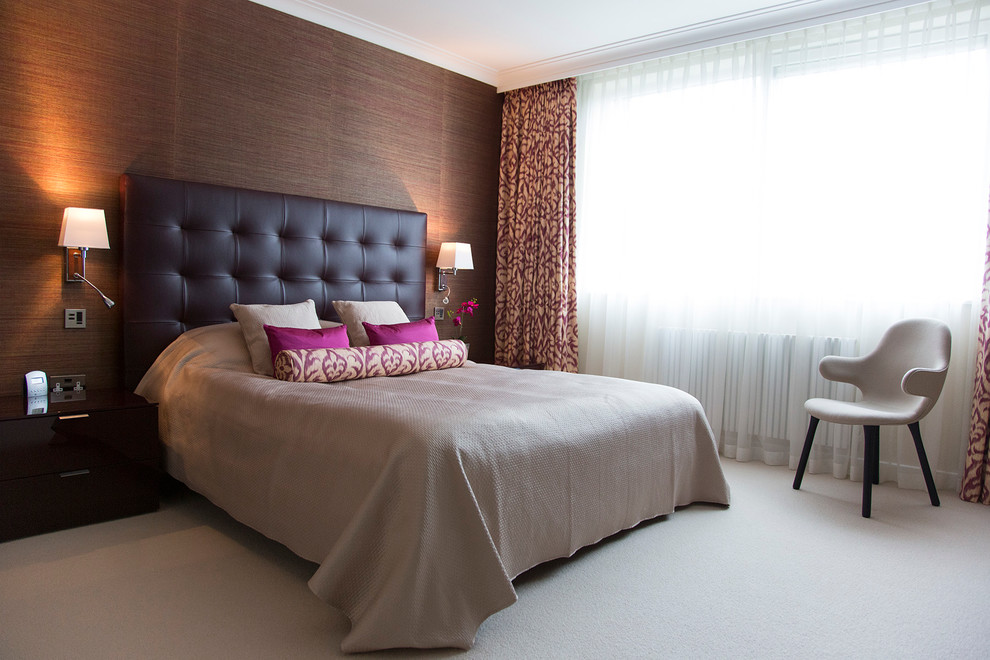 Mid-sized contemporary master bedroom in London with purple walls, carpet and no fireplace.
