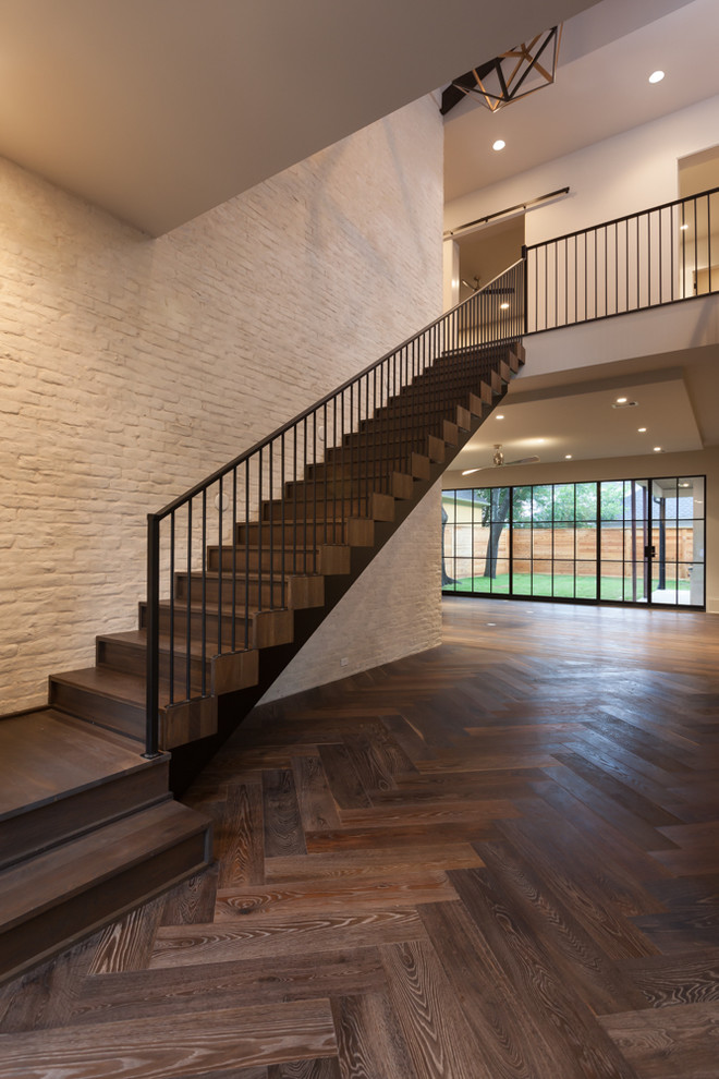 Inspiration for a large transitional wooden straight staircase remodel in Houston with wooden risers