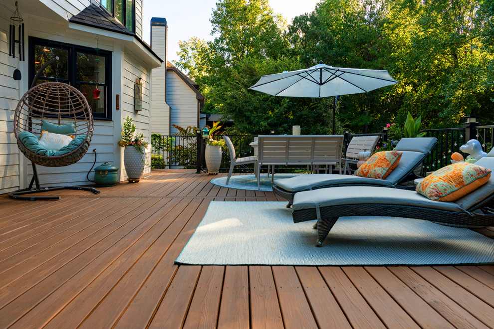 Huge transitional backyard second story metal railing deck photo in Atlanta