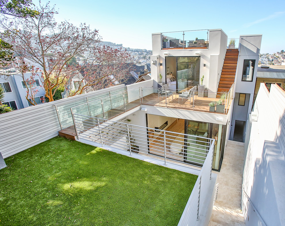 This is an example of a large modern backyard deck in San Francisco with no cover.