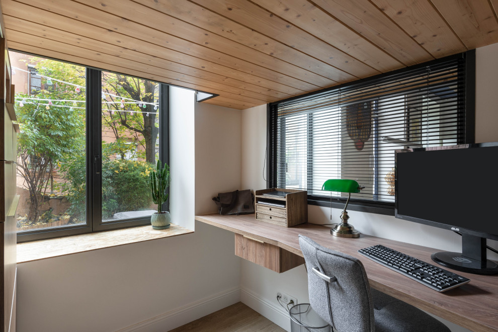 This is an example of a small study in Lyon with a timber clad ceiling.