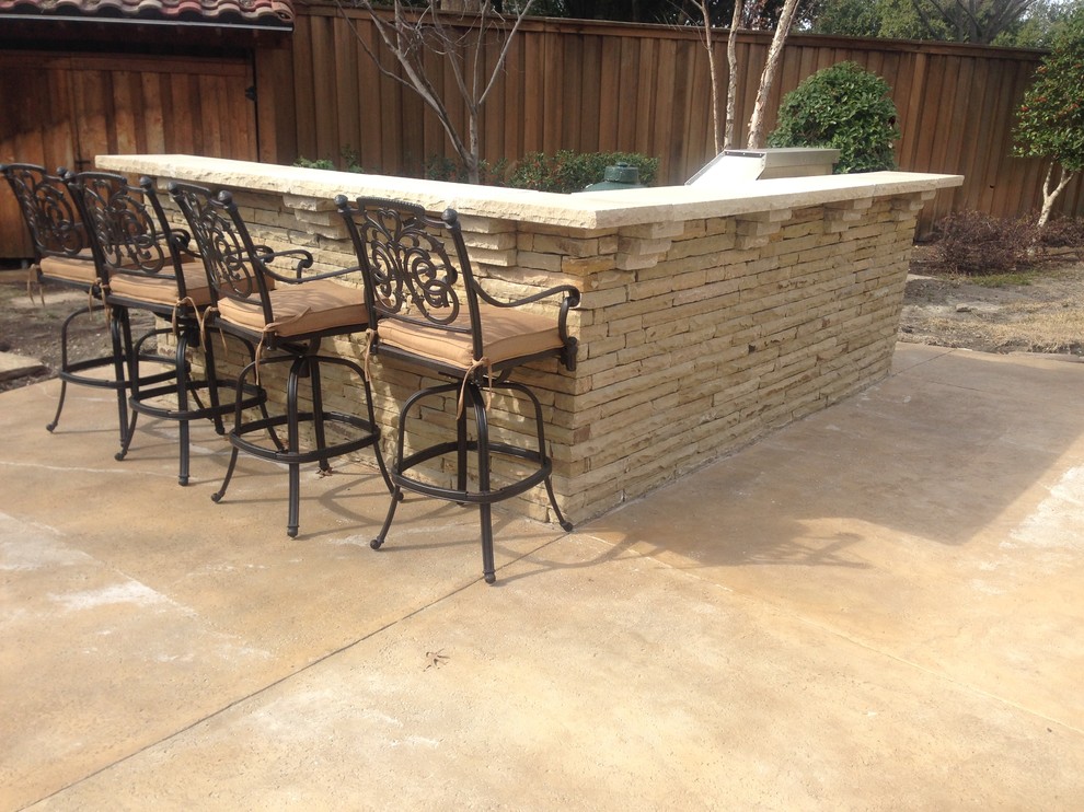 Large mountain style backyard stamped concrete and custom-shaped natural hot tub photo in Dallas