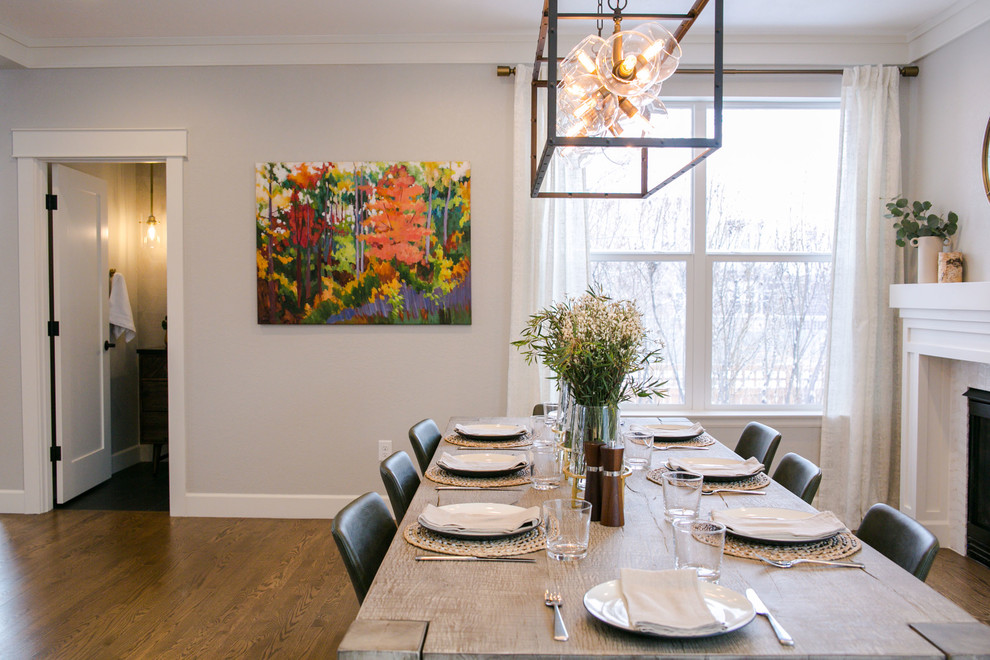 Large transitional single-wall medium tone wood floor and brown floor kitchen/dining room combo photo in Denver with an undermount sink, shaker cabinets, white cabinets, quartz countertops, multicolored backsplash, marble backsplash, stainless steel appliances, an island and white countertops