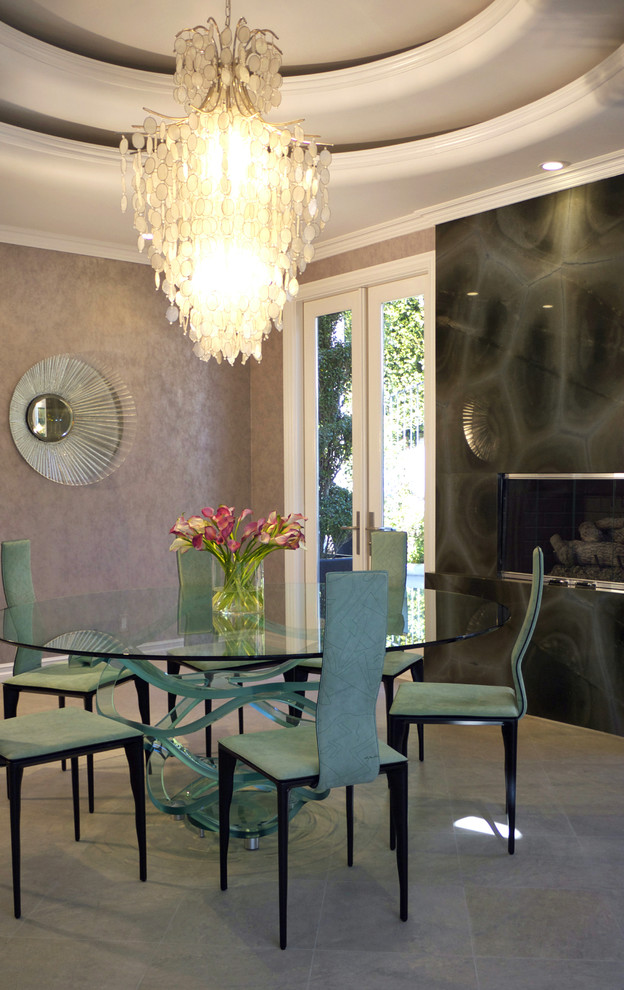 Inspiration for a large contemporary separate dining room in Orange County with metallic walls, slate floors, a standard fireplace and a stone fireplace surround.