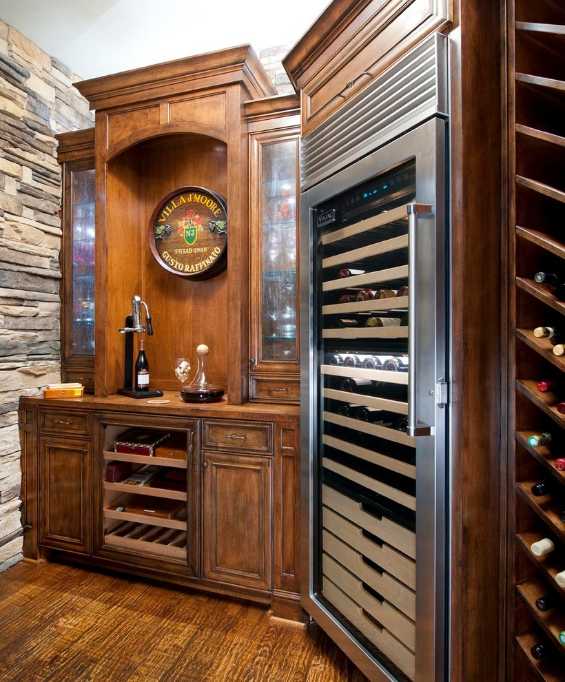 Photo of a traditional wine cellar in Dallas with storage racks.
