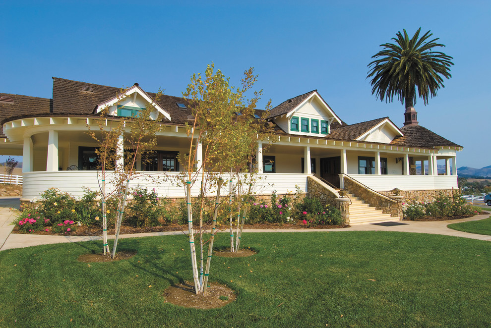 This is an example of a large country two-storey exterior in San Luis Obispo with wood siding.