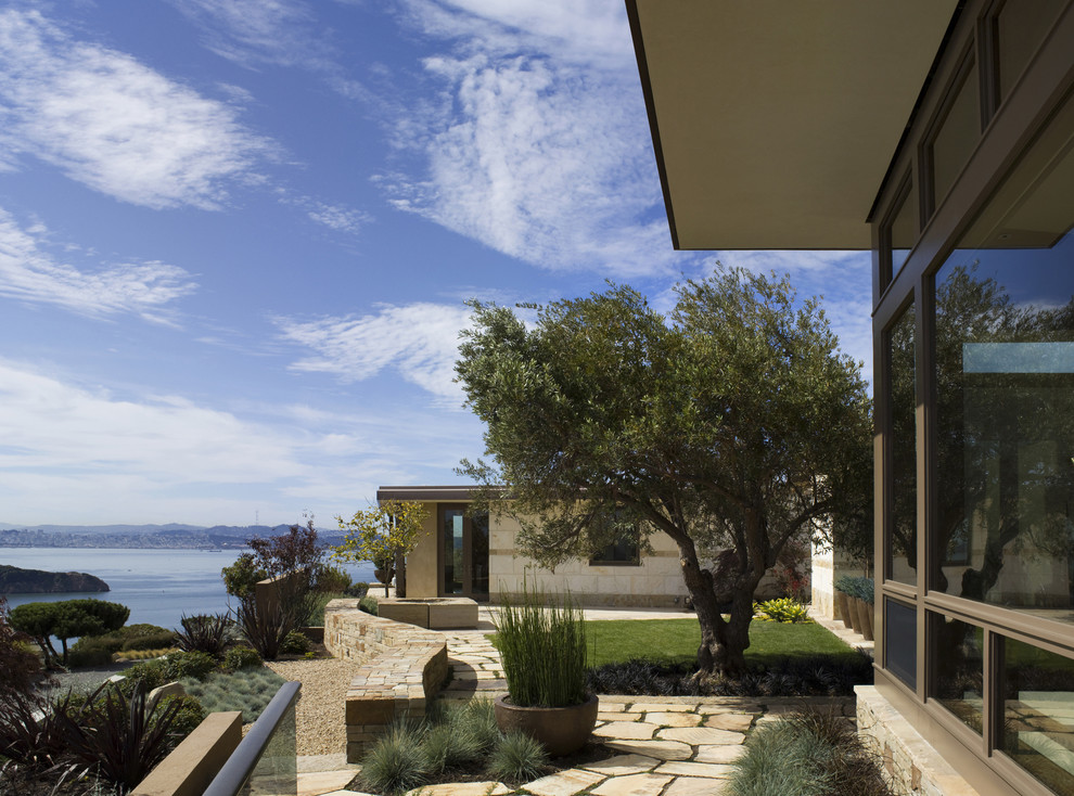 Inspiration for a contemporary side garden in San Francisco with natural stone paving.