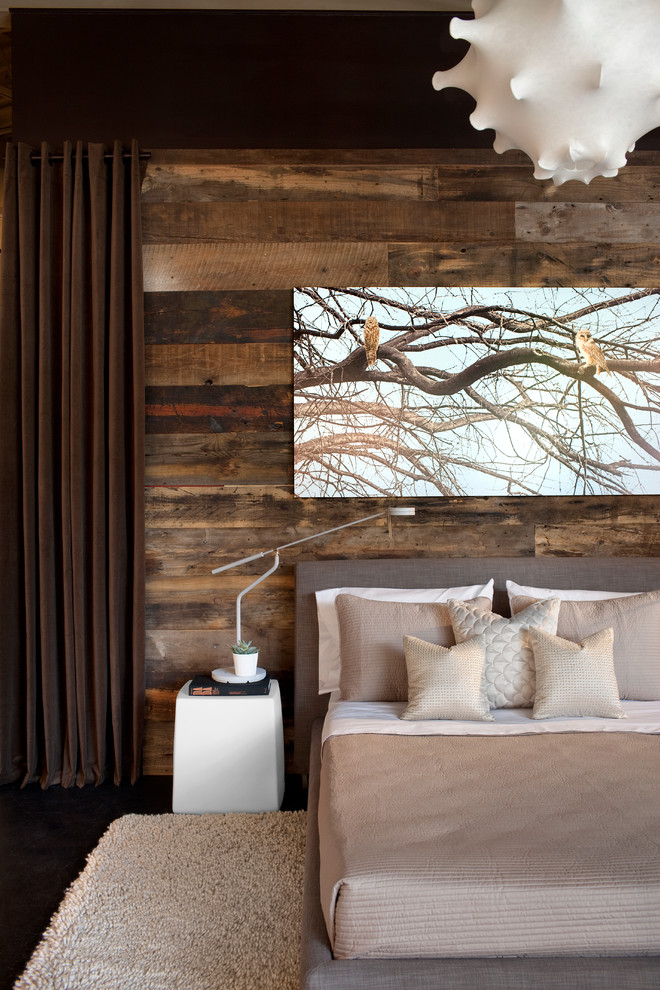 This is an example of a contemporary bedroom in Atlanta with dark hardwood floors.