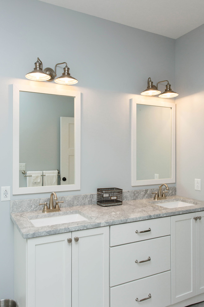 Large traditional master bathroom in Boston with shaker cabinets, white cabinets, a drop-in tub, a corner shower, gray tile, marble, grey walls, ceramic floors, an undermount sink, granite benchtops, grey floor and a hinged shower door.